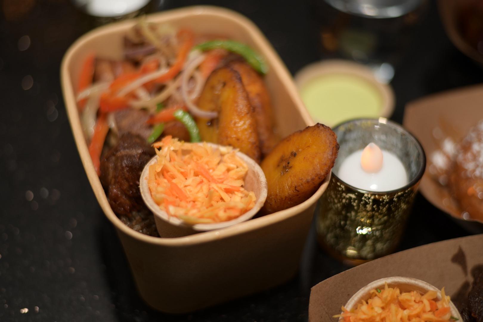 Caribbean bowl with fried pork, plantains, and pikliz